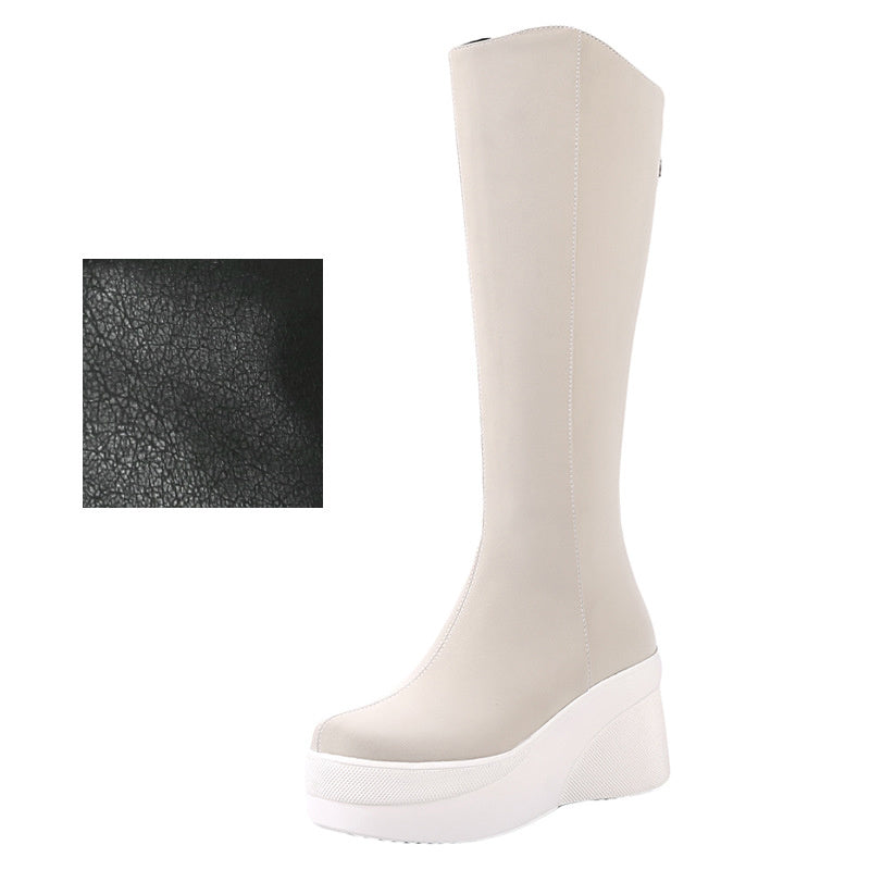 Beige knee-high boot with a close-up inset of black textured material on a white background