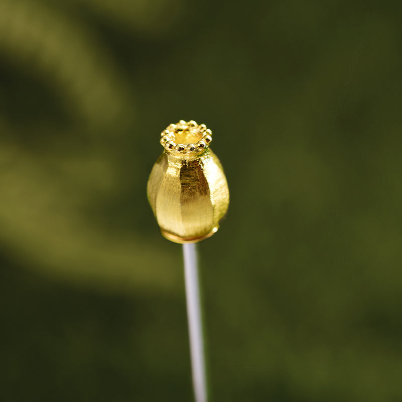 Gold-colored decorative element on a green background