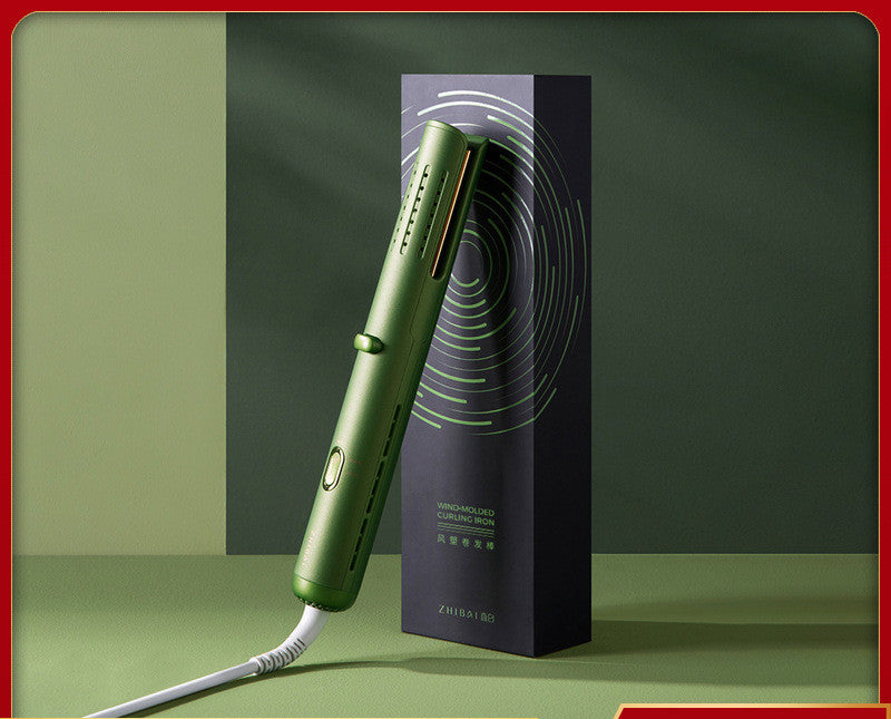 Green hair straightener with packaging on a green background