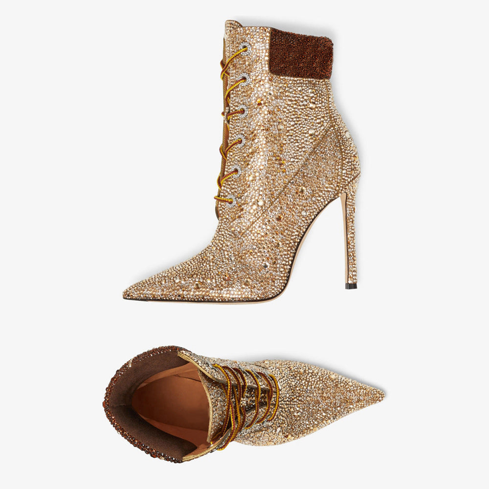 Gold beaded high-heeled boots on a white background