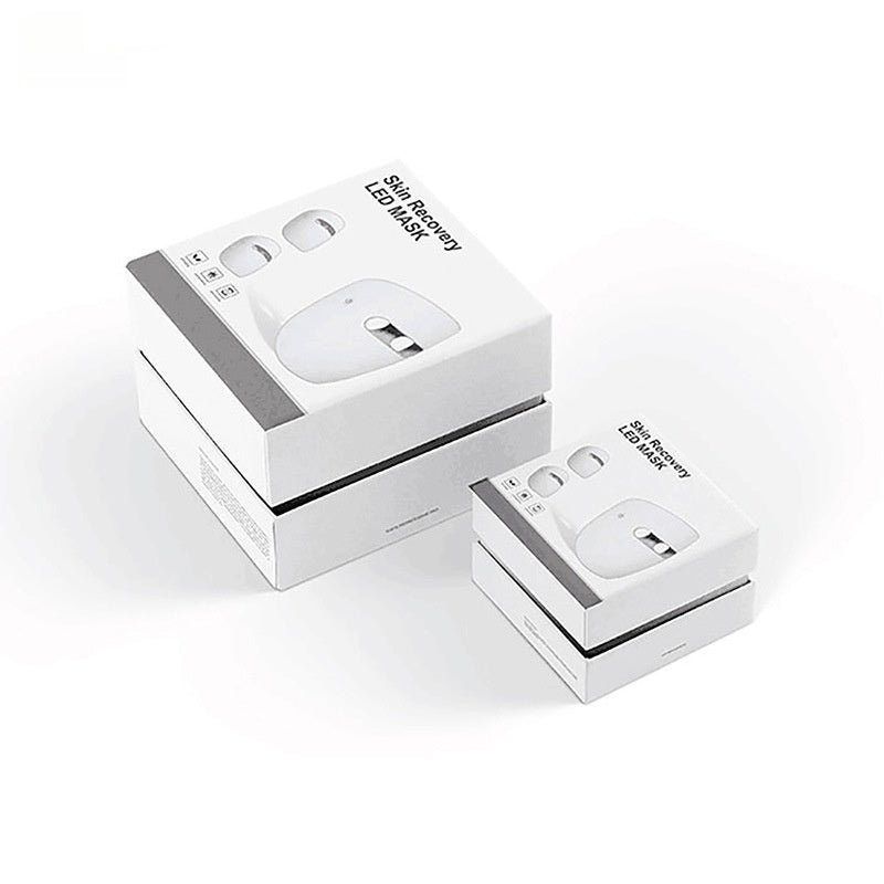 Two white electronic devices in their packaging on a white background