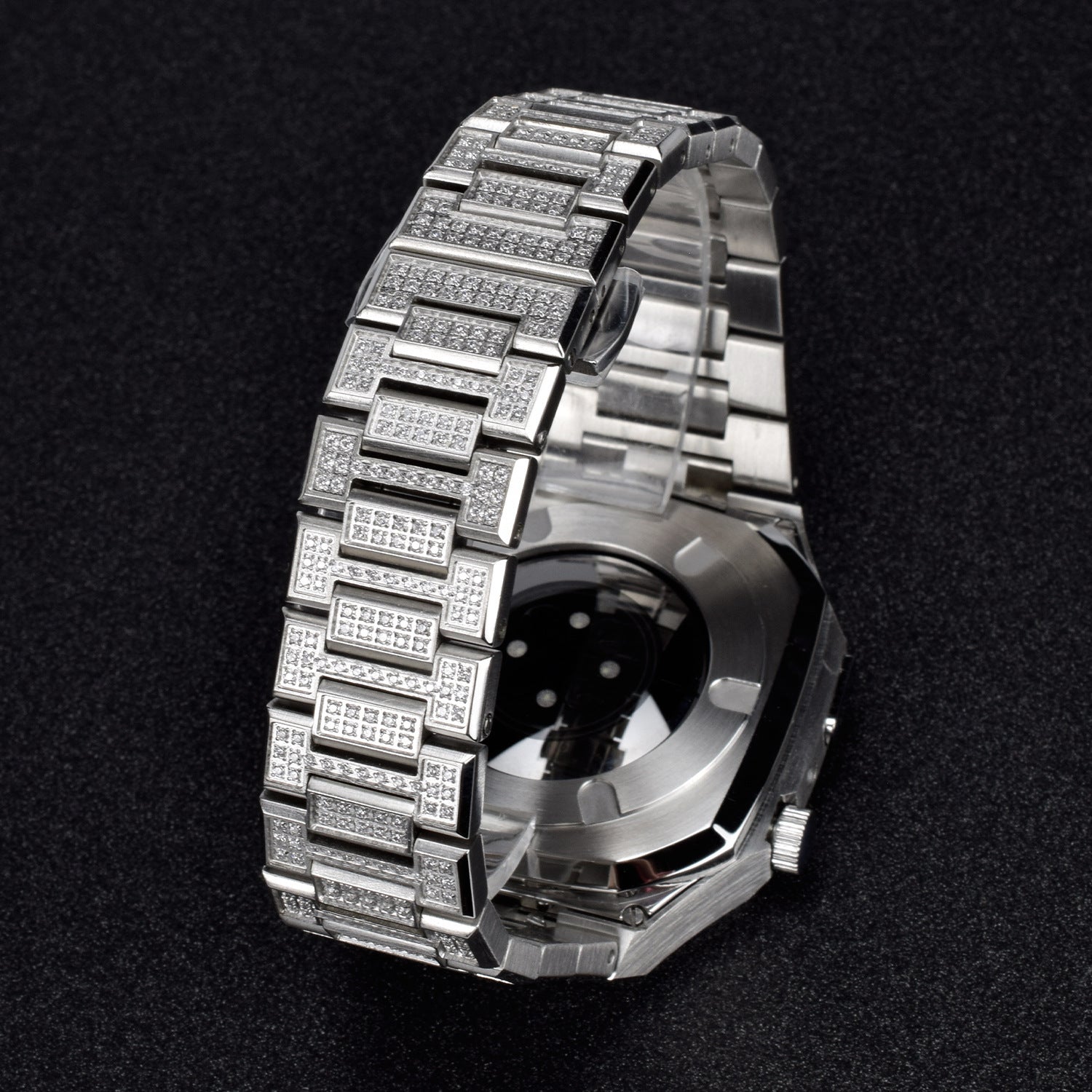 Silver watch with diamond-studded band on a black background