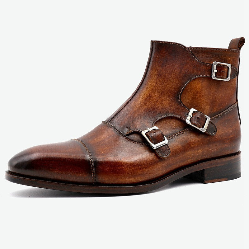 Brown leather boot with silver buckles on a white background