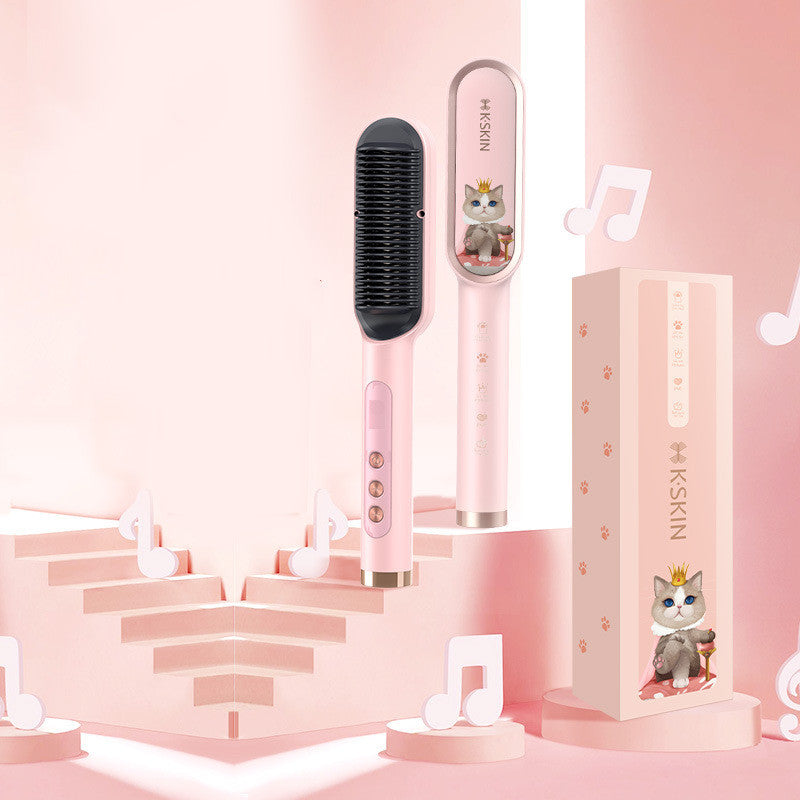 Pink hair straightening brush with cartoon cat design on a pink background