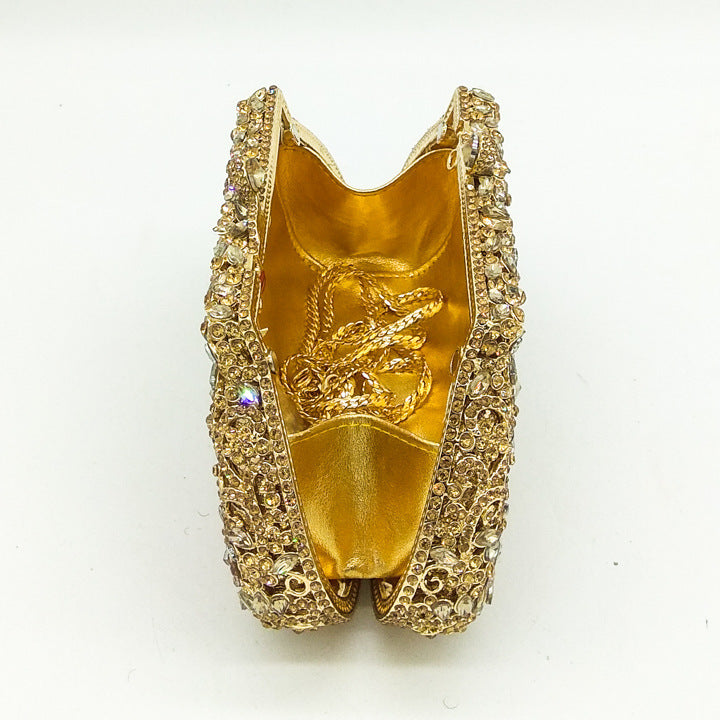 Gold shoe with intricate design on a white background