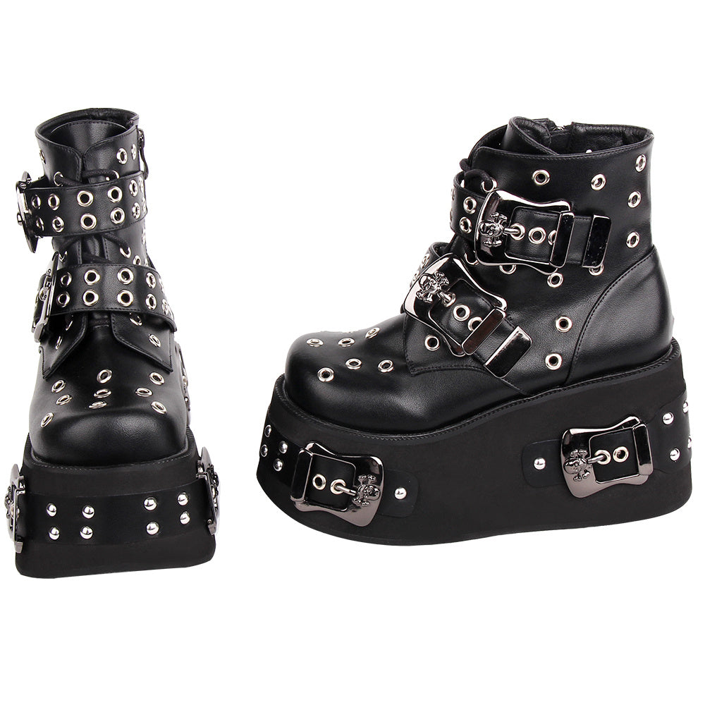 Black platform boots with silver buckles and studs on a white background