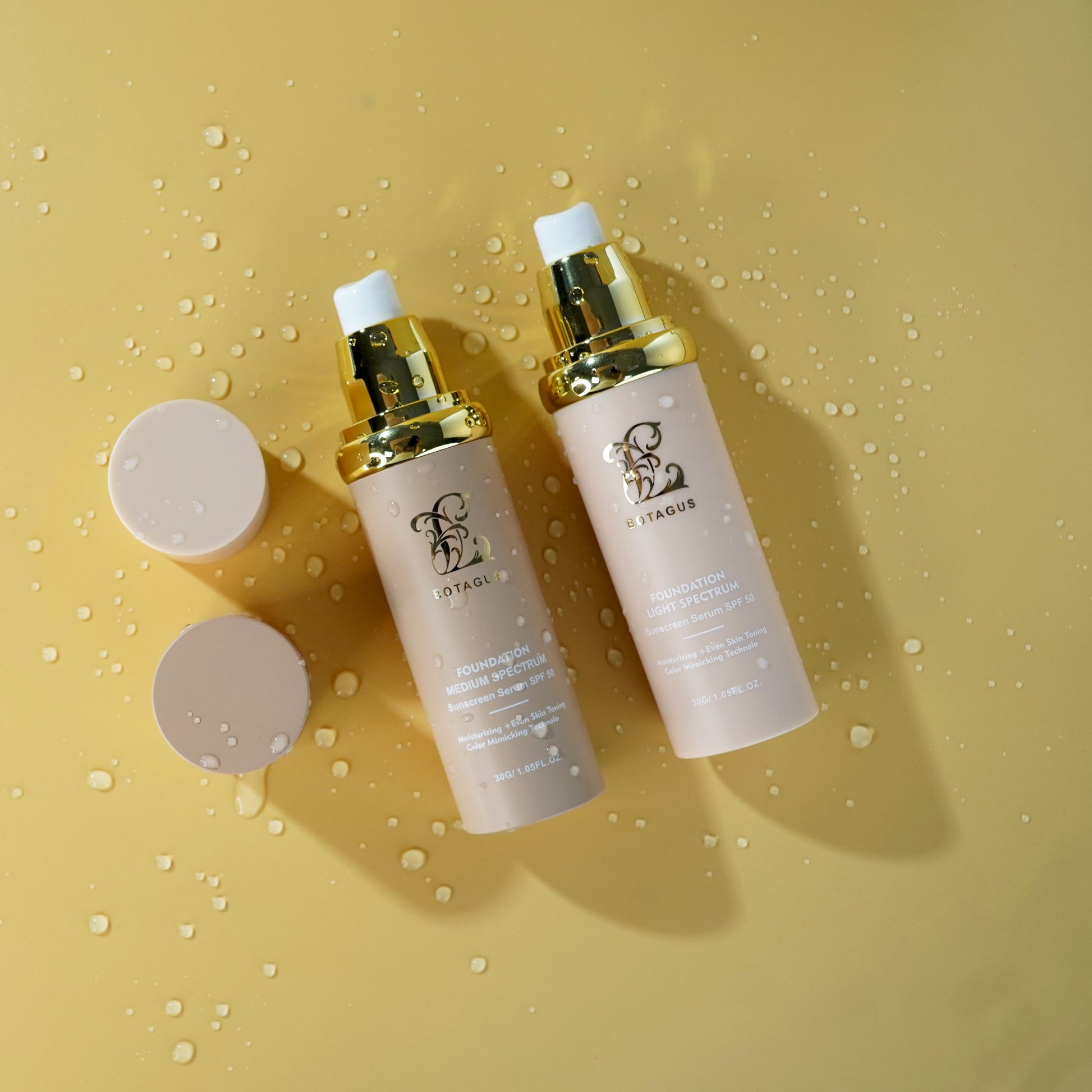 Two skincare bottles with gold caps on a yellow background