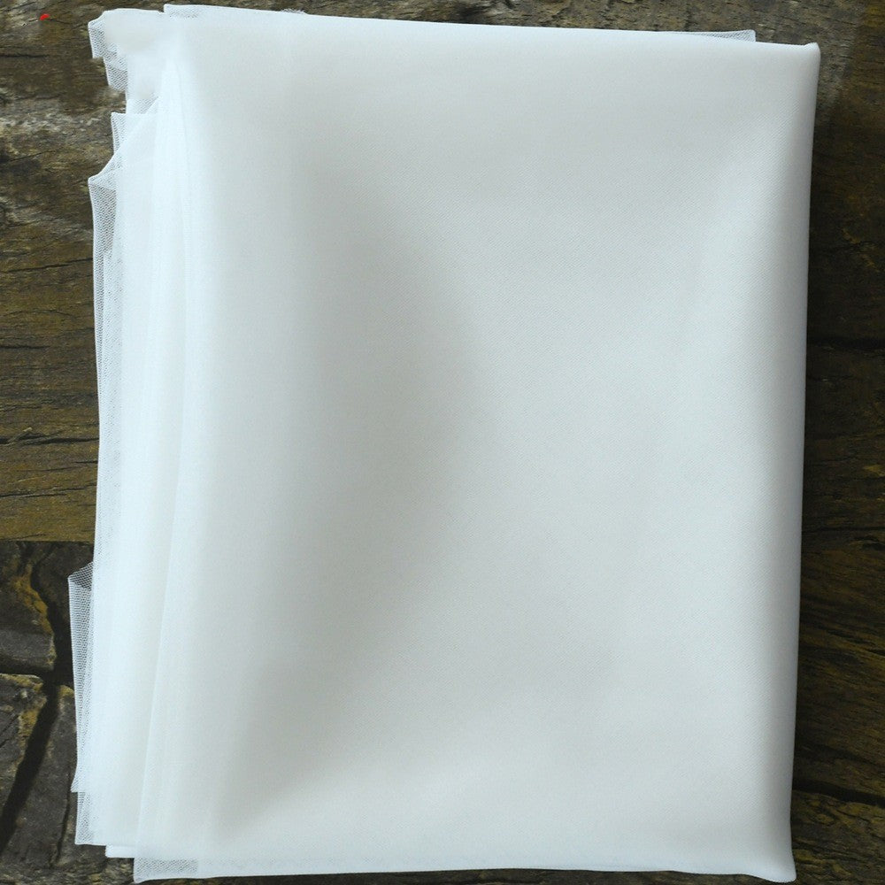 Stack of white paper sheets on a wooden surface