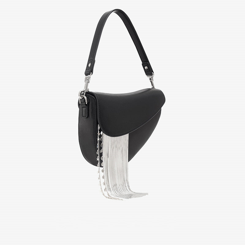 Black saddle bag with white fringe details on a white background