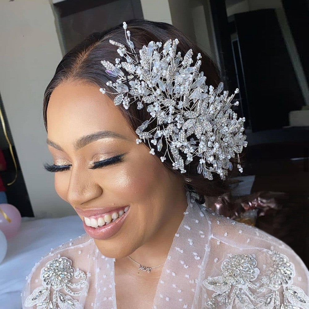 Woman wearing a decorative headpiece with a blurred indoor background