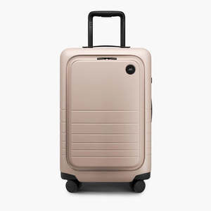 Beige suitcase with wheels on a white background
