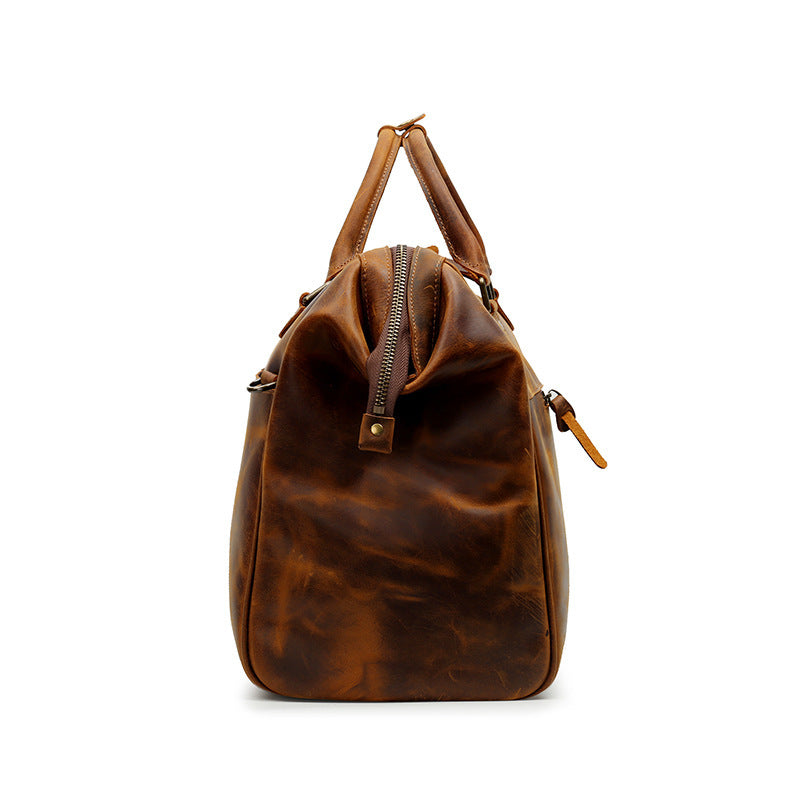 Brown leather bag with a zipper on a white background