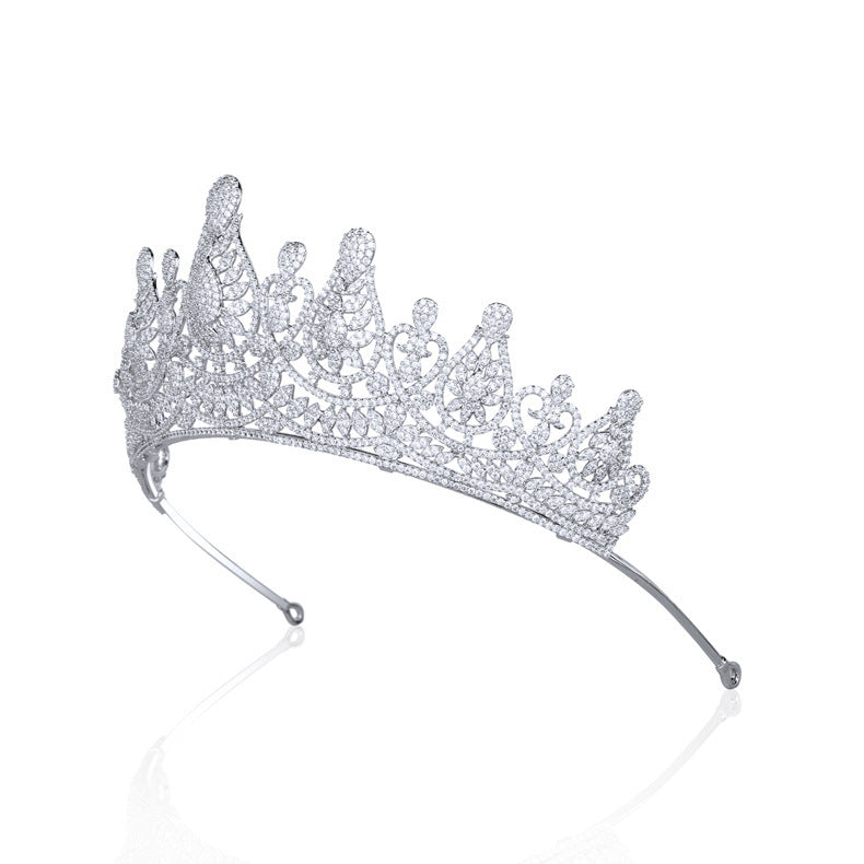 Silver tiara with clear stones on a white background