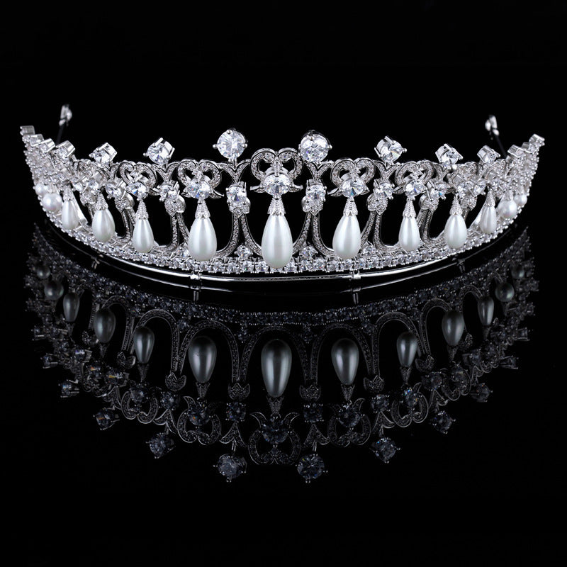 Elegant diamond and pearl tiara on a black background