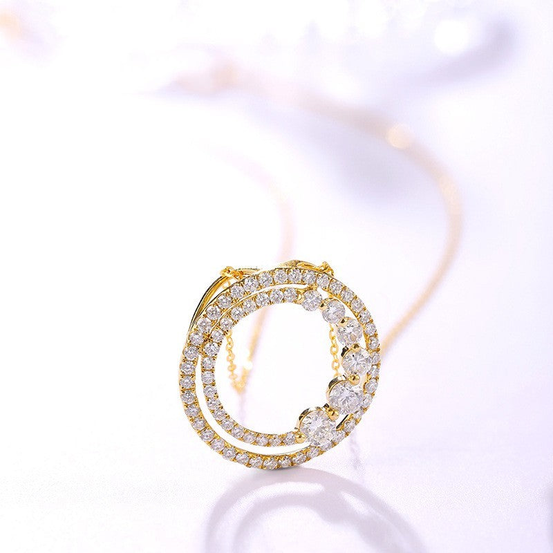 Gold and diamond earring on a white background
