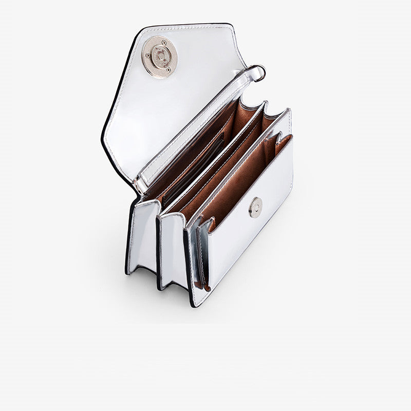 Silver wallet with open design on a white background