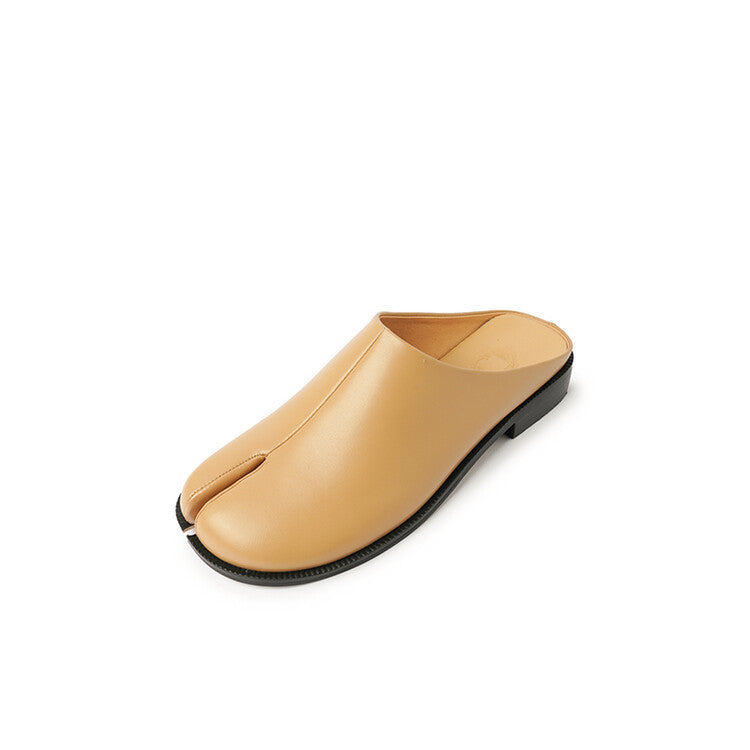 Beige slipper with a black sole on a white background