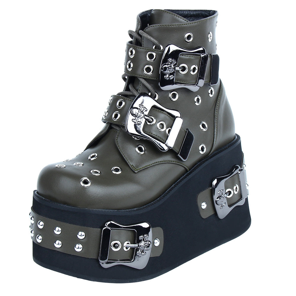 Black platform boot with silver buckles and studs on a white background