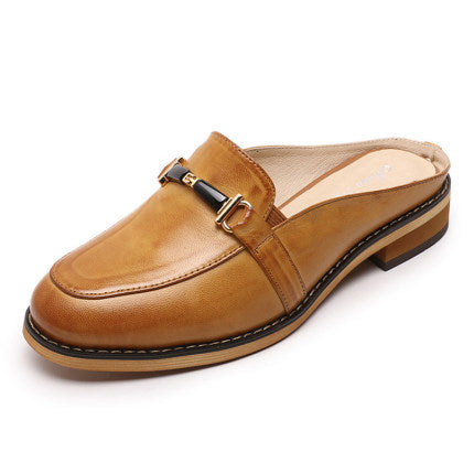 Brown leather slip-on shoe with a gold buckle on a white background