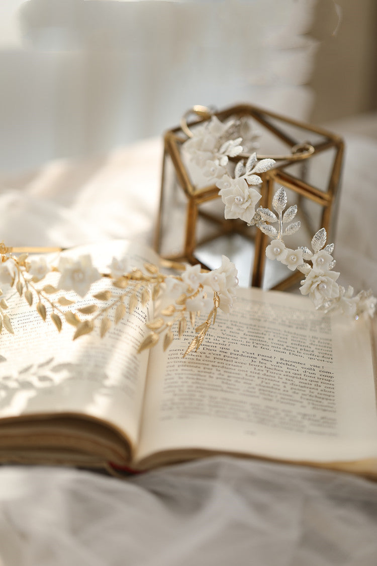 Floral headpiece on an open book with a soft background
