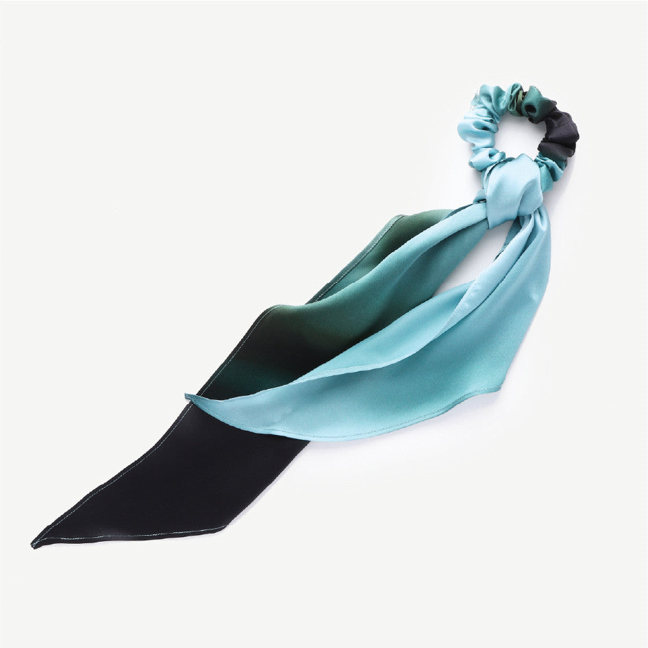 Turquoise and black hair scarf with a scrunchie on a white background