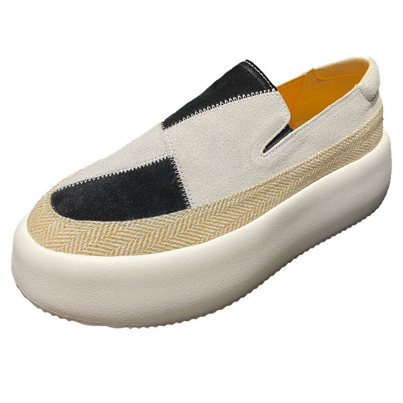 White slip-on shoe with black and beige accents on a white background
