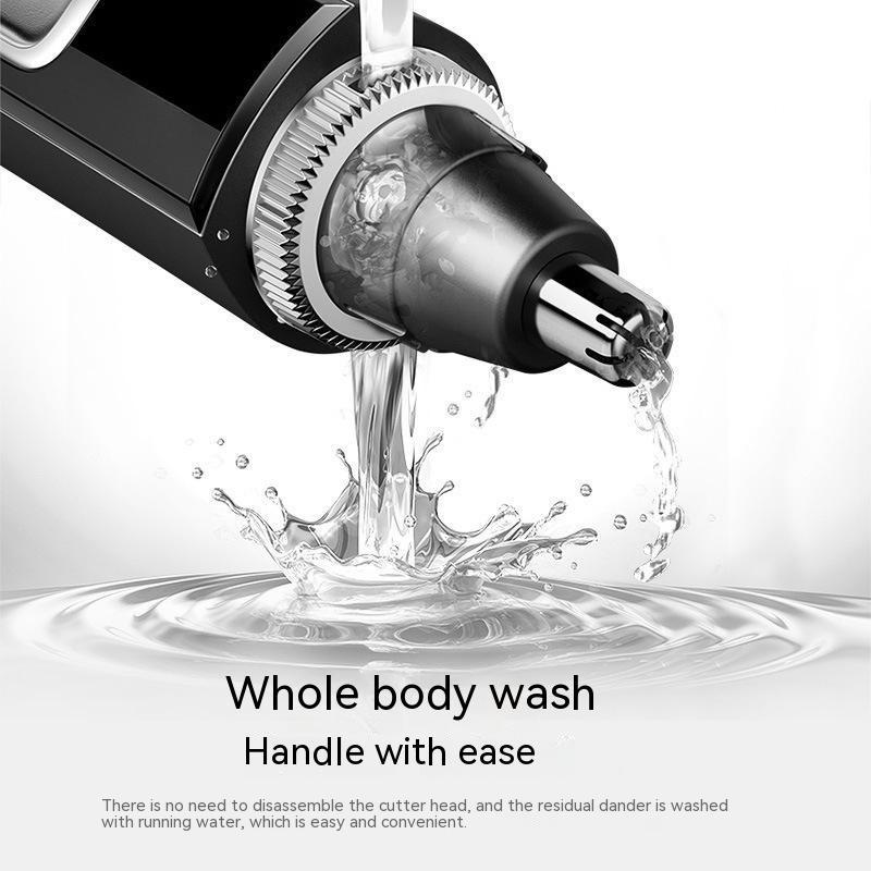 Electric shaver with water flowing over it on a white background