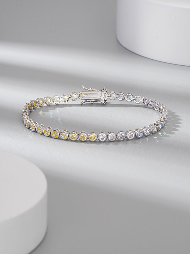 Silver bracelet with colorful stones on a light gray background