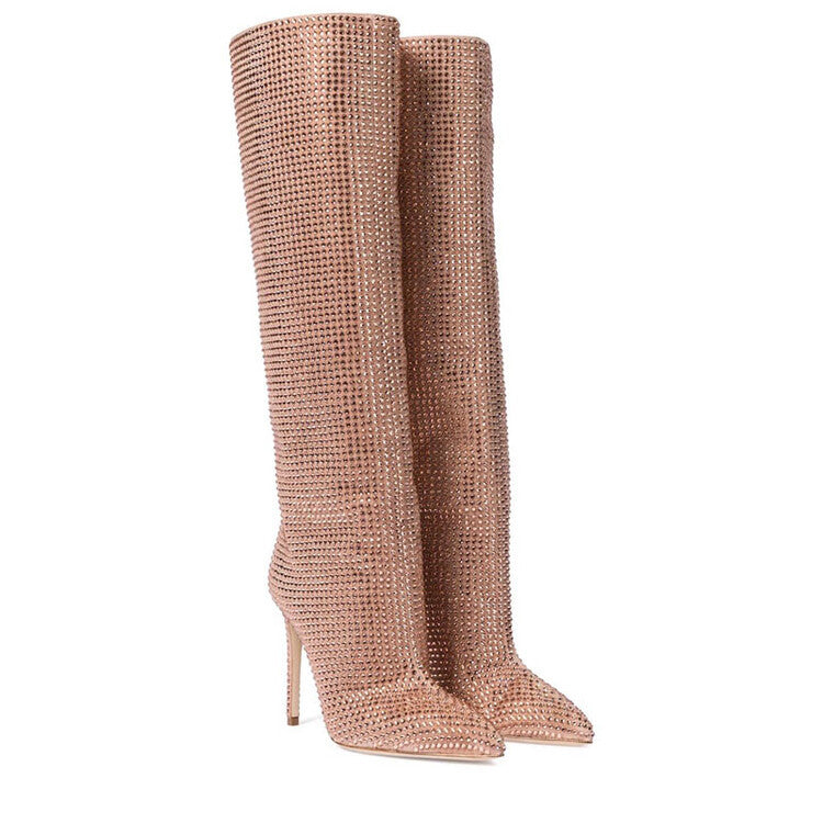 Pair of pink textured knee-high boots on a white background