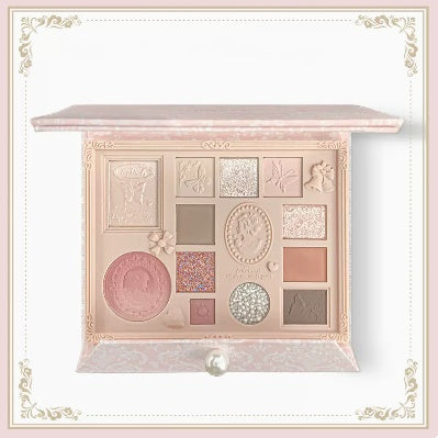 Makeup palette with various shades on a decorative background