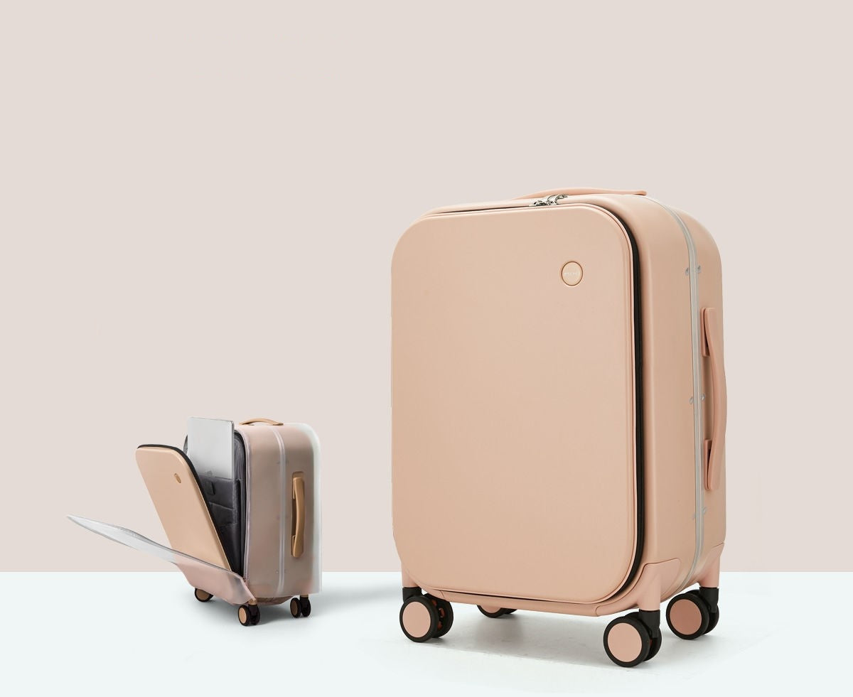 Beige suitcase with a smaller suitcase attached on a light beige background