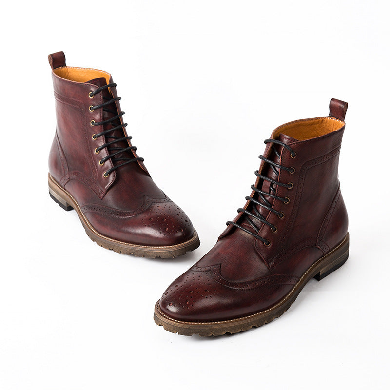 Pair of brown leather boots on a white background