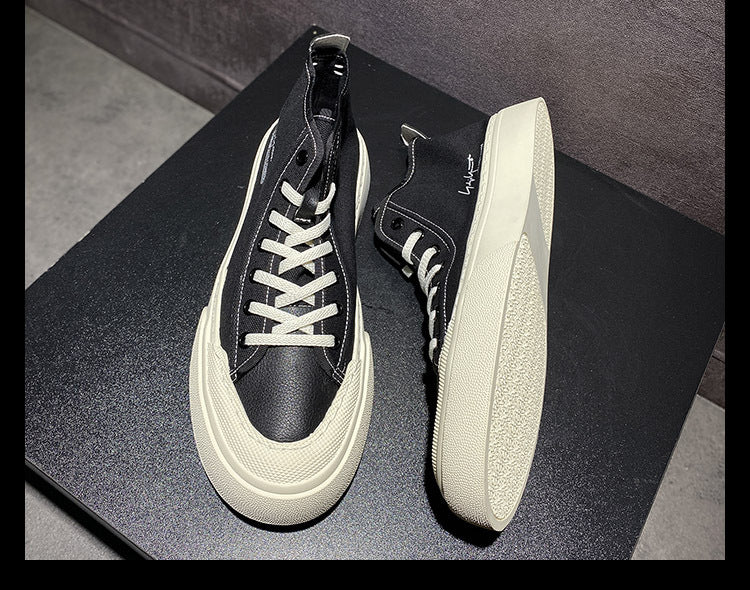 Black and white sneakers on a dark surface with a blurred background