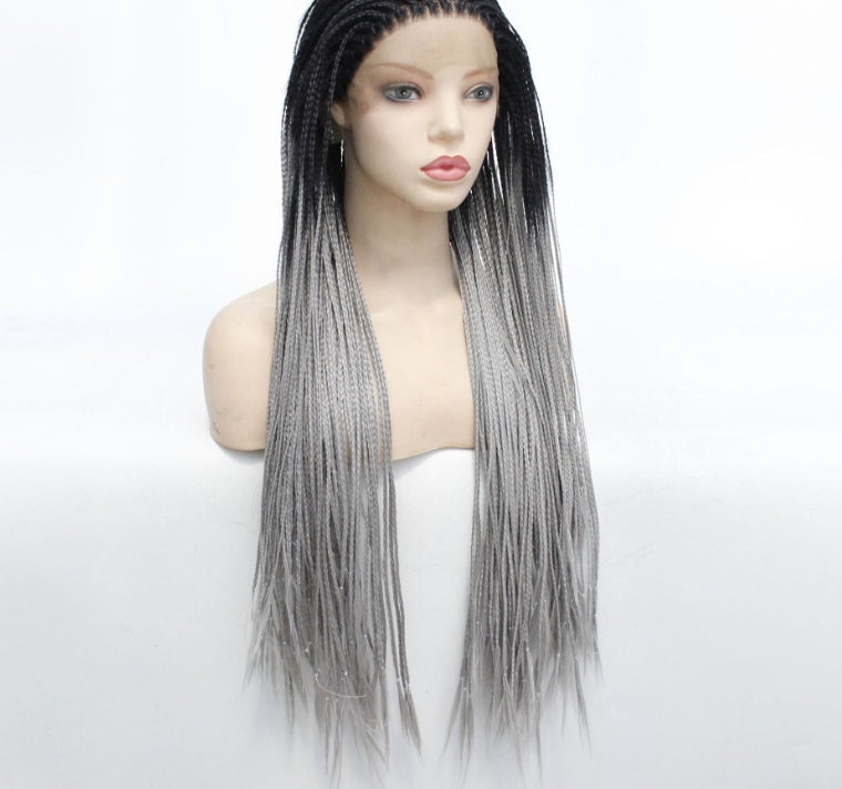 Mannequin head with a gray and black ombre wig on a white background