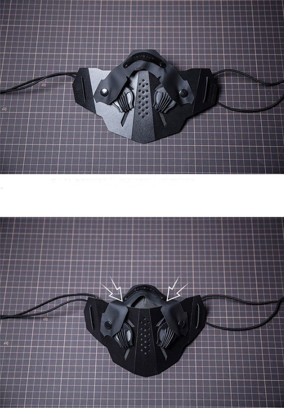 Black leather mask with decorative elements on a grid background