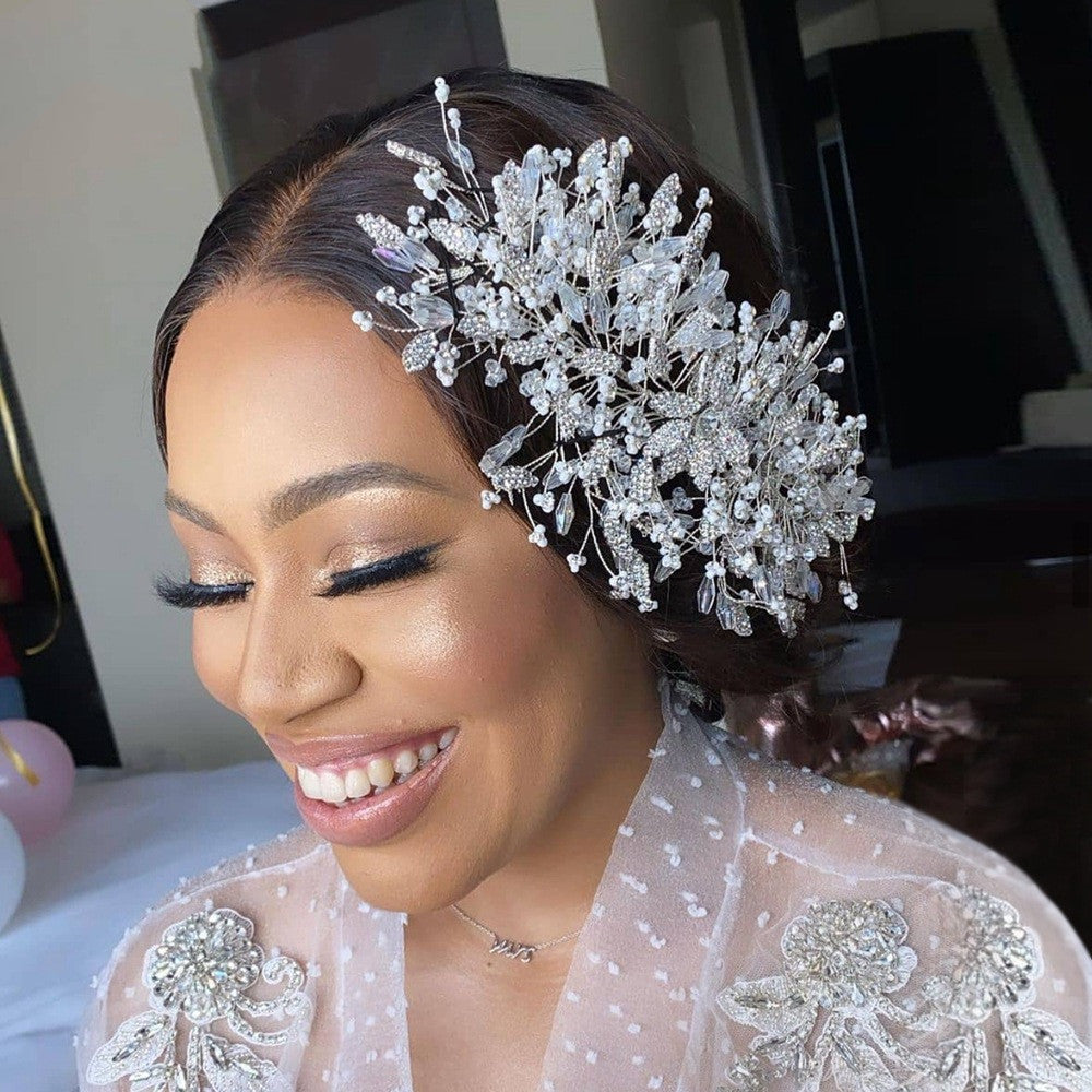 Woman wearing a decorative headpiece with a blurred indoor background