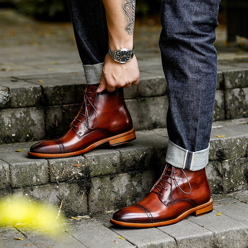 Brown leather boots worn by a person on stone steps.