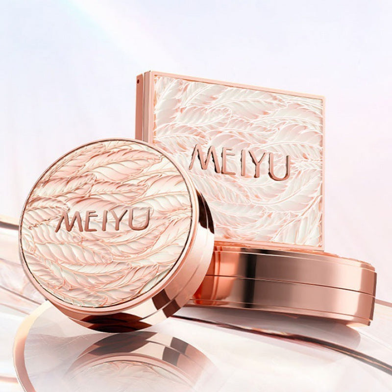 Rose gold MEIYU cosmetic case with round mirror on a light background