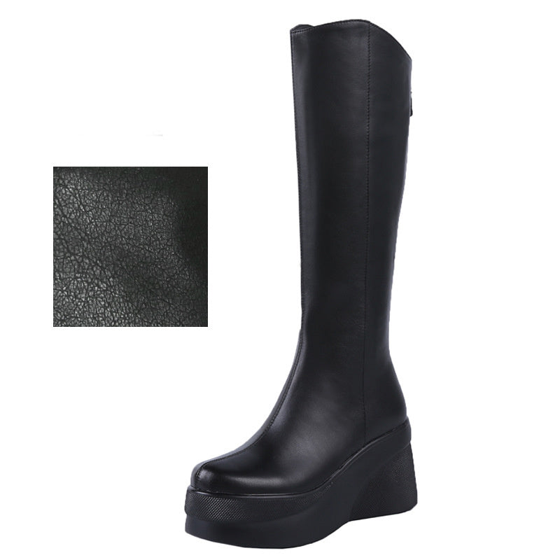 Black knee-high boot with a close-up inset of leather texture on a white background