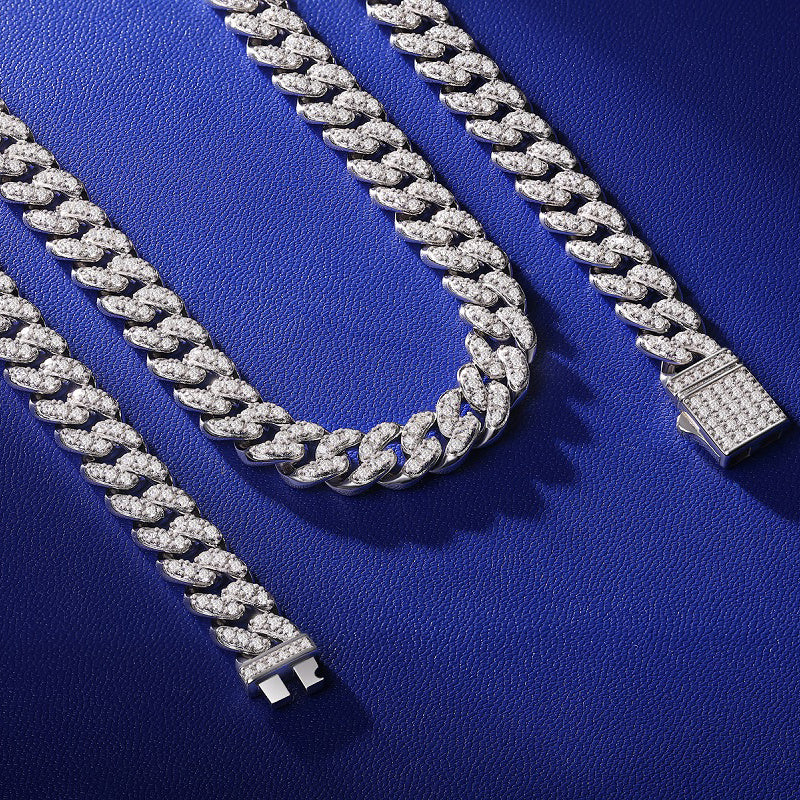 Silver chain bracelet on a blue textured background