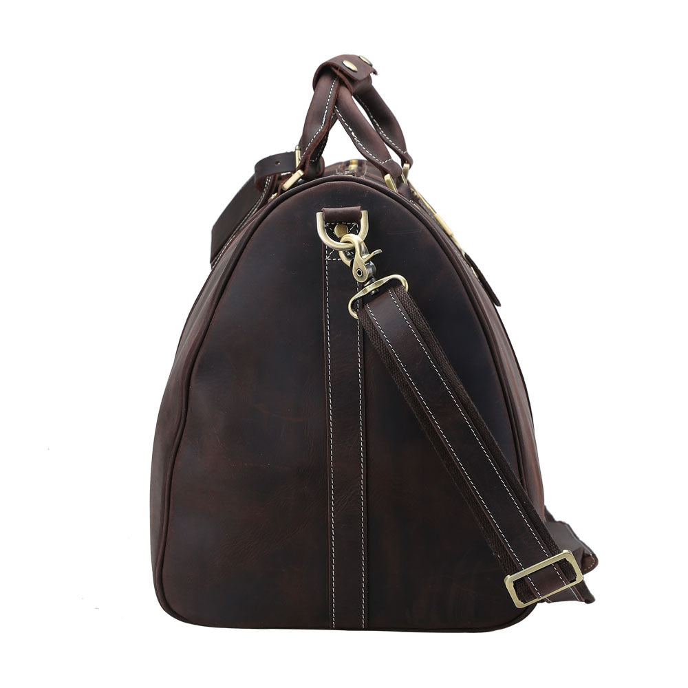 Brown leather bag with shoulder strap on a white background