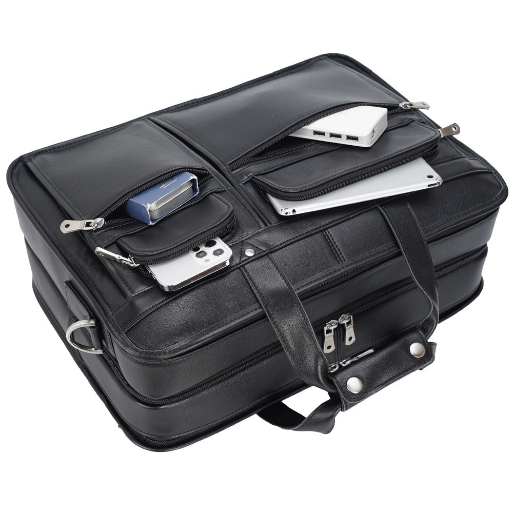 Black briefcase with compartments and electronic devices on a white background