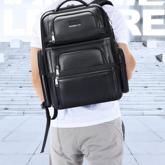 Person wearing a black backpack in an urban setting
