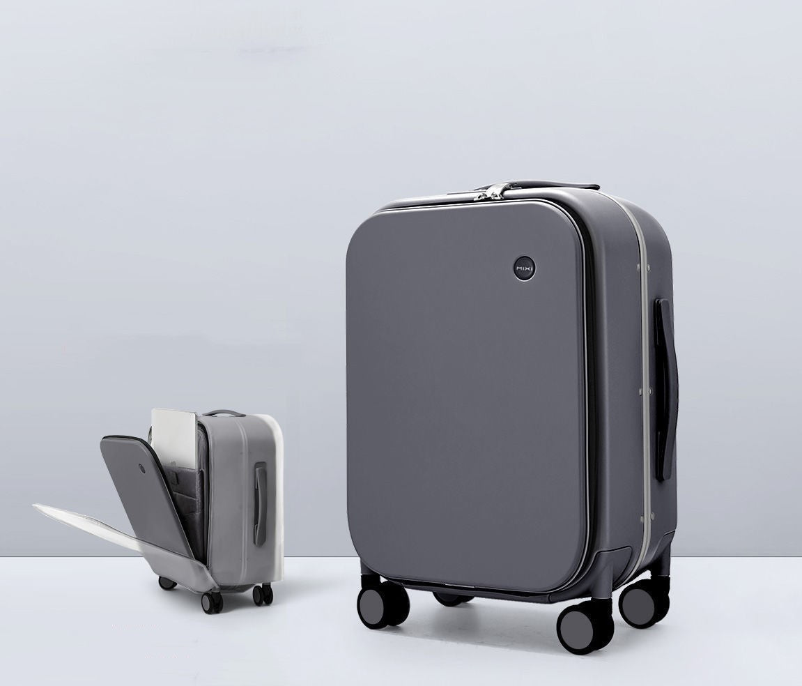 Gray suitcase with a smaller suitcase on wheels next to it on a light gray background