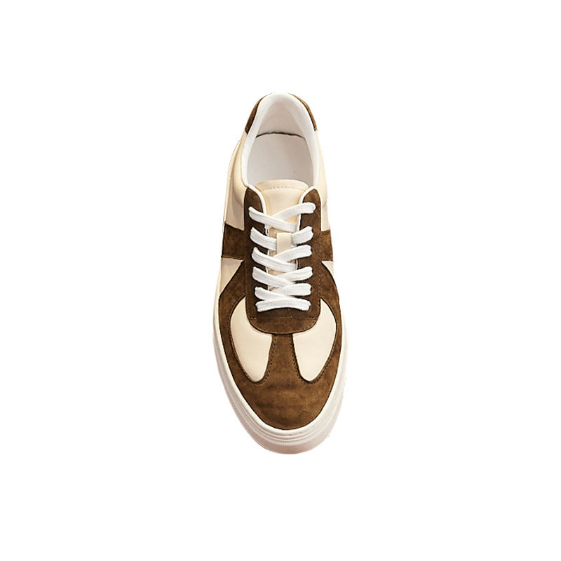 Brown and beige sneaker with white laces on a white background