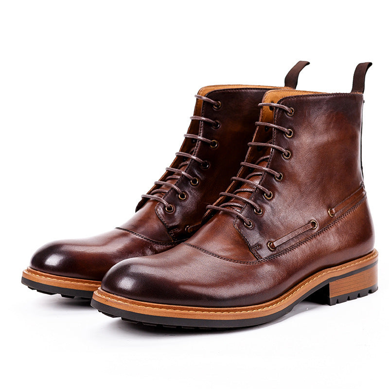 Pair of brown leather boots on a white background