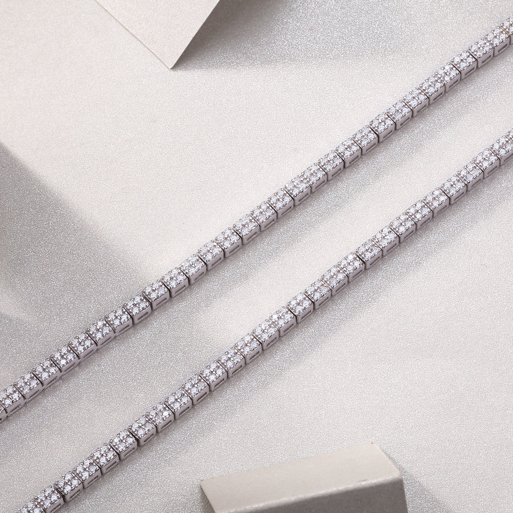 Diamond tennis bracelet on a light gray background
