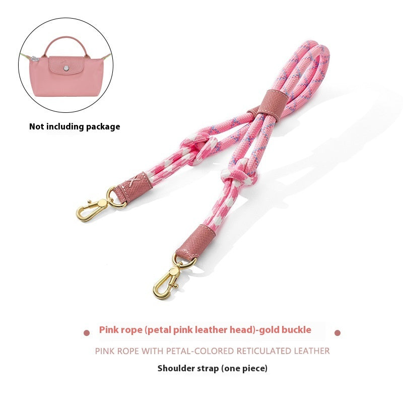 Pink rope shoulder strap with gold buckle on a white background