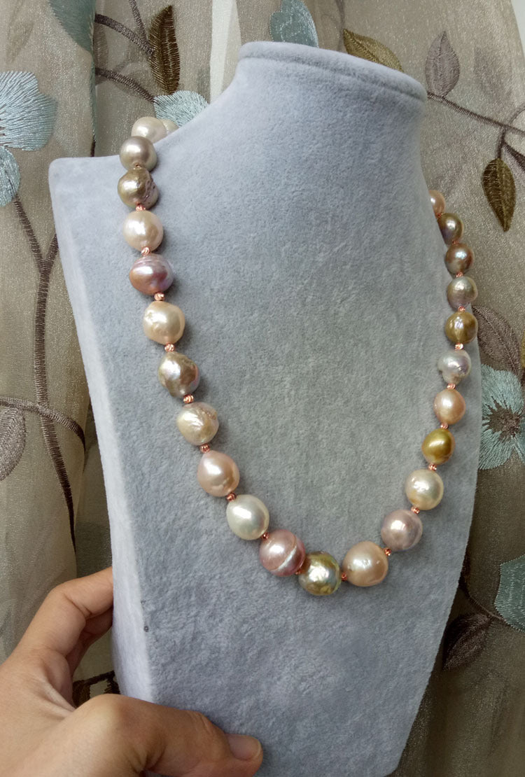 Pearl necklace on a mannequin bust with a floral-patterned background