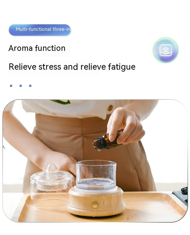 Person using a multi-functional three-in-one device with an aroma function, shown on a white background.